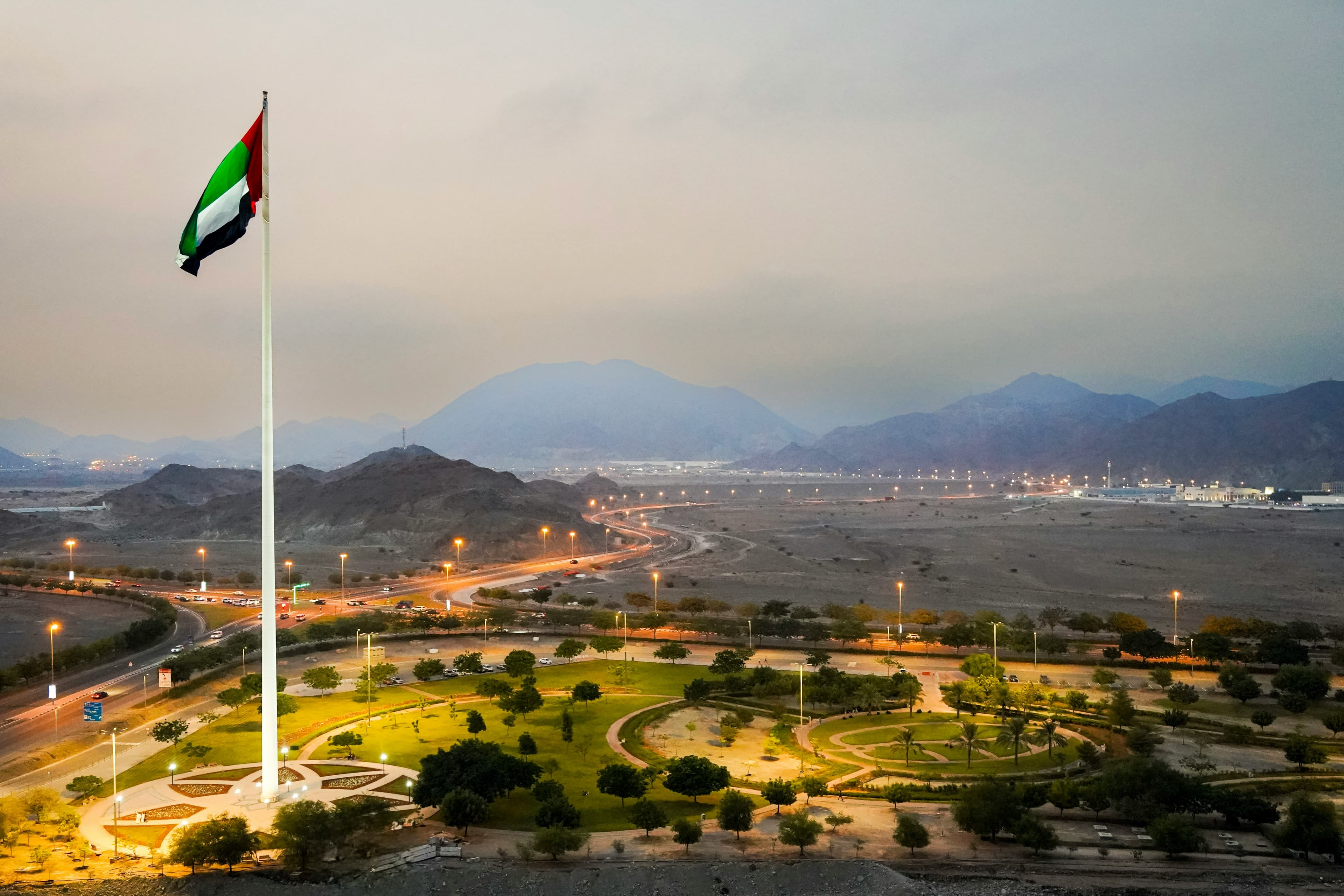 UAE National Flag and Sovereign Mountain Landscape